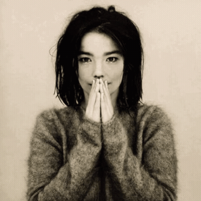 Woman In Sweater Covering Face With Hands GIF