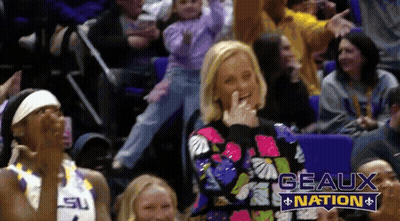 Woman In Sweater Laughing In Stands Says Geaux Nation GIF
