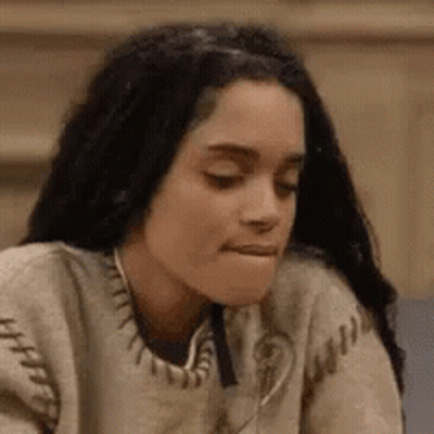 Woman In Sweater Making Face GIF