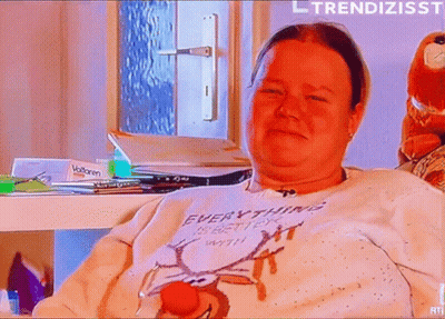 Woman in Sweater Saying Everything Is Better With a Red Nose