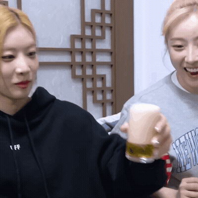 Woman In Sweatshirt Saying I FF Holding Glass GIF