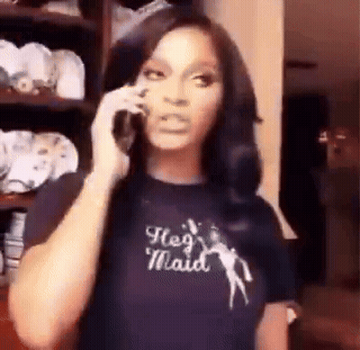 Woman In T-Shirt Saying He's Maid On Phone GIF