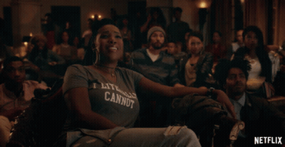 Woman in T-Shirt Saying I Literally Cannot Sits in Crowd