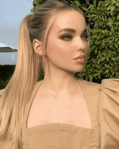 Woman In Tan Dress With Ponytail GIF