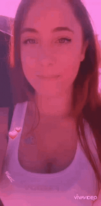 Woman In Tank Top Next To Man In Black Shirt GIF
