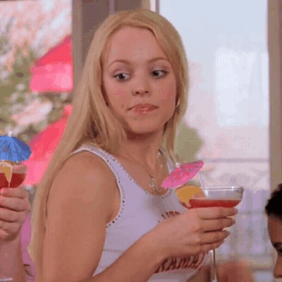 Woman In Tank Top With Kama Holding Martini GIF