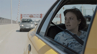 Woman In Taxi Looking Out Window With Container 7 Sign GIF