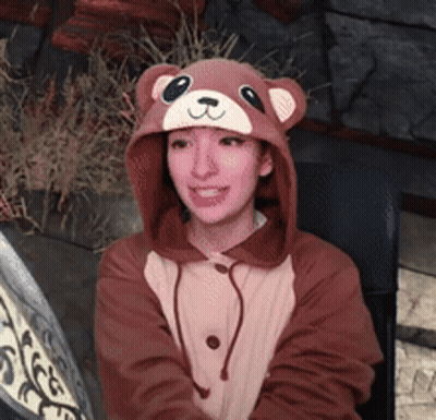 Woman In Teddy Bear Hooded Jacket And Hat GIF