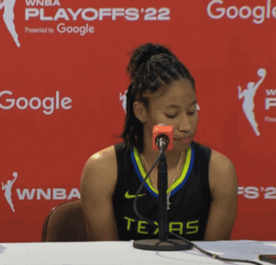 Woman In Texas Jersey Sitting At Table With Google Sign GIF