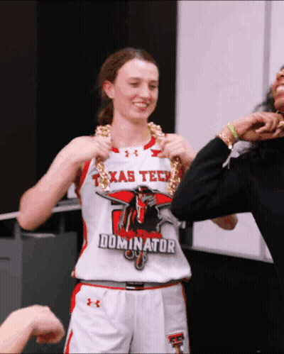 Woman In Texas Tech Jersey Holding Chain GIF