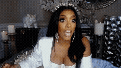 Woman In Tiara And Earrings Making Funny Face GIF