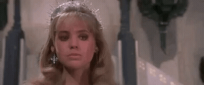 Woman In Tiara And Earrings Sitting On Throne GIF