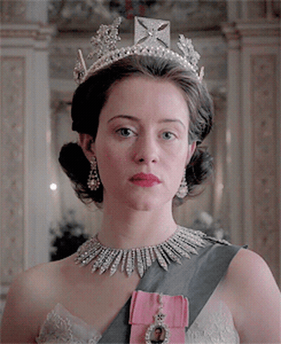 Woman In Tiara And Necklace With Pink Sash GIF