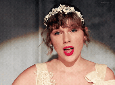 Woman In Tiara And White Dress With Red Lipstick GIF