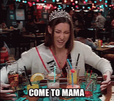 Woman In Tiara At Table With Drinks Saying Come To Mama GIF