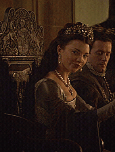Woman In Tiara Sits Next To Man GIF