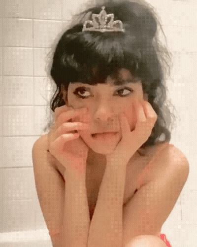 Woman In Tiara Sitting In Bathtub Making Funny Face GIF