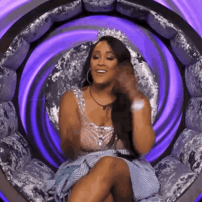 Woman In Tiara Sitting In Purple Chair GIF