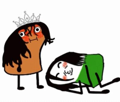 Woman In Tiara Standing Next To Woman Laying On Ground GIF
