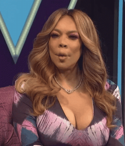 Woman In Tie Dye Dress Making Face GIF