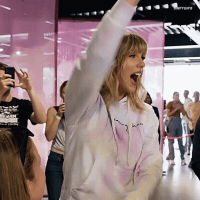 Woman In Tie Dye Hoodie Saying Taylor GIF