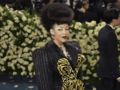 Woman In Tiger Print Dress GIF