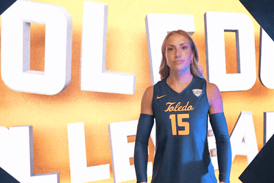 Woman In Toledo 15 Jersey In Front Of Sign GIF