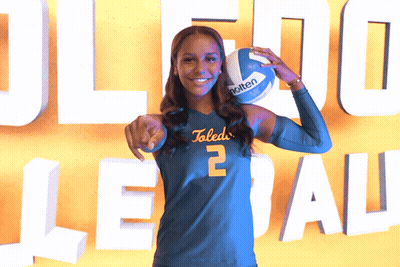 Woman In Toledo Jersey Holding Molten Volleyball GIF