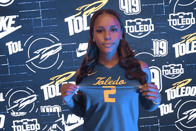 Woman In Toledo Jersey Holding Up Shirt GIF
