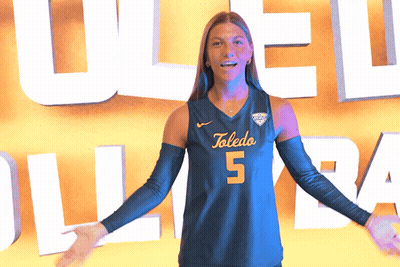 Woman In Toledo Jersey Holding Volleyball GIF