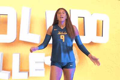 Woman In Toledo Jersey In Front Of Yellow Wall GIF
