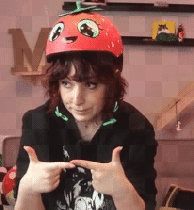 Woman in Tomato Helmet Thumbs Up