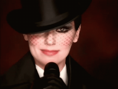 Woman In Top Hat And Veil Smiling GIF