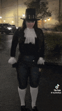 Woman In Top Hat And White Socks On Street GIF