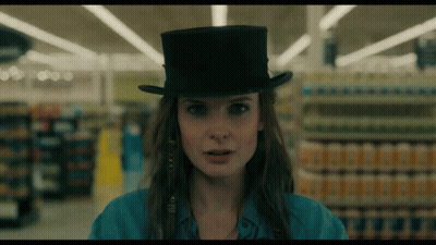 Woman In Top Hat In Supermarket GIF