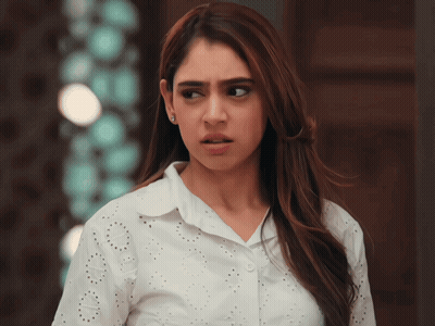 Woman In Torn White Shirt Looking To Side GIF