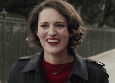 Woman in Trench Coat and Red Lipstick Smiling