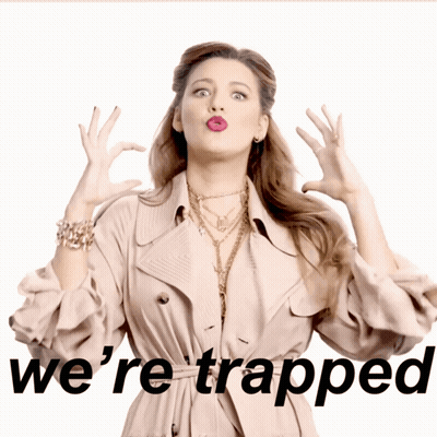 Woman In Trench Coat Saying We're Trapped GIF