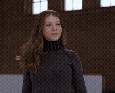 Woman In Turtleneck Clapping GIF
