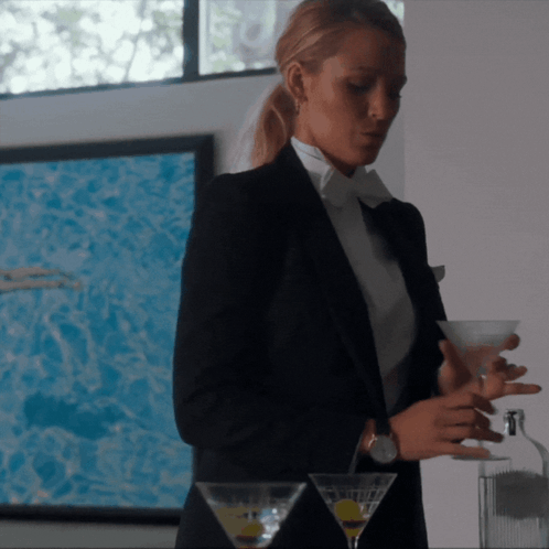 Woman In Tuxedo Holding Martini GIF