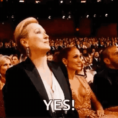 Woman In Tuxedo Saying Yes GIF