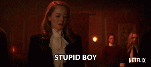 Woman In Tuxedo Stands In Front Of Netflix Logo GIF