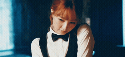 Woman In Tuxedo With Bow Tie GIF