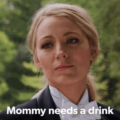 Woman In Tuxedo With Text Mommy Needs A Drink GIF