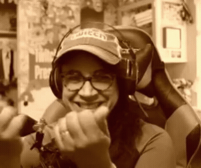 Woman in Twitch Hat and Headphones Smiling