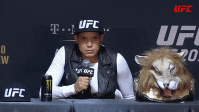 Woman In UFC Hat Sitting At Table GIF