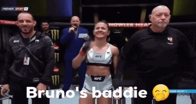 Woman In UFC Top Standing In Front Of Referee GIF