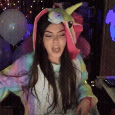 Woman In Unicorn Costume With Balloons And Keyboard GIF