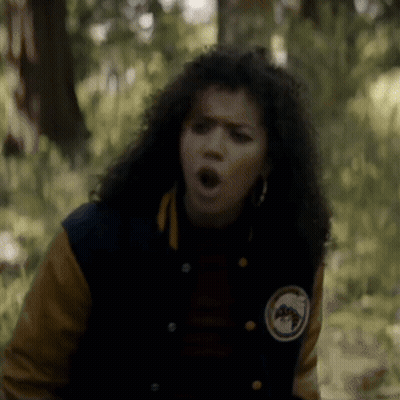 Woman In Varsity Jacket Making Funny Face GIF