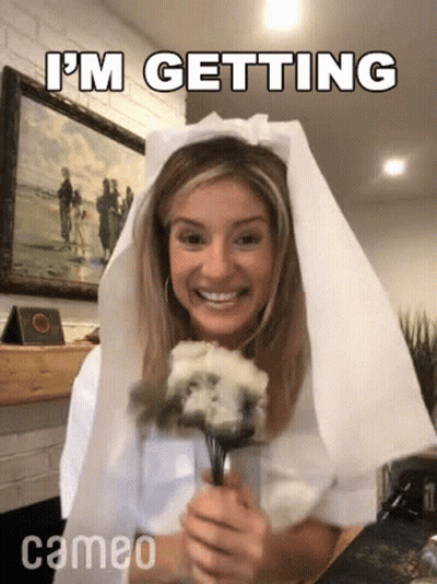Woman In Veil Holding Bouquet GIF